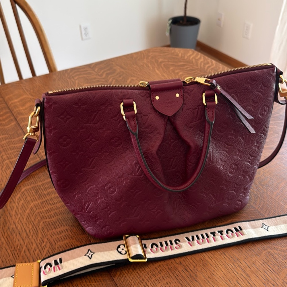 Cranberry red LV bag. Adding my LV logo strap as it matches perfectly.